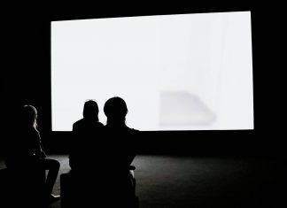 people under projector screen