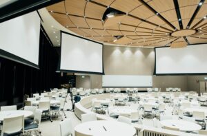 white projector screens in conference room